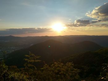 Scenic view of mountains against sky during sunset