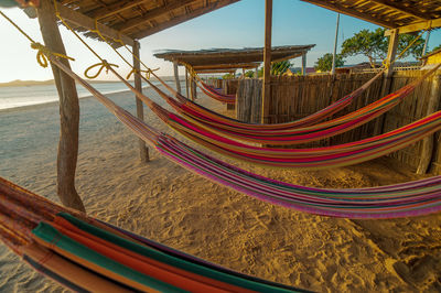 Close-up of hammocks at beach