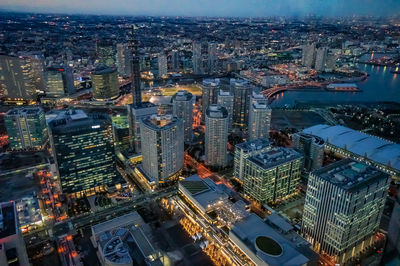 High angle view of illuminated modern buildings in city