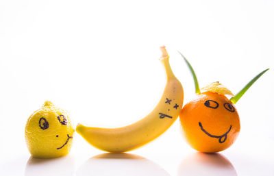 Close-up of fruits against white background