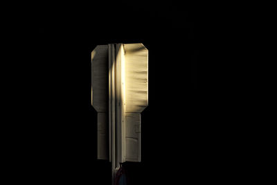 Close-up of electric lamp against black background