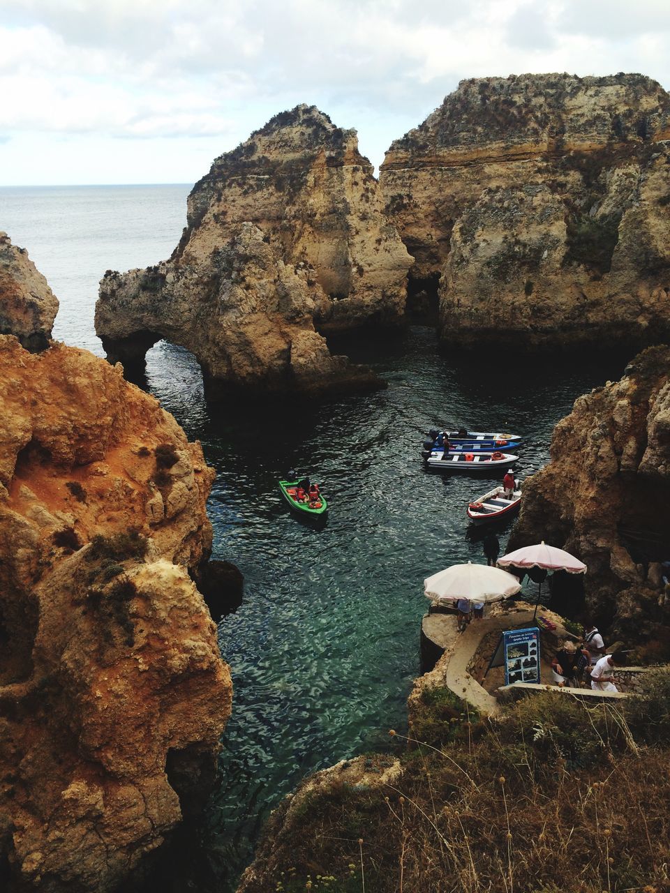 sea, water, sky, rock - object, horizon over water, tranquility, scenics, tranquil scene, beach, rock formation, beauty in nature, nature, shore, rock, transportation, cliff, mountain, nautical vessel, mode of transport