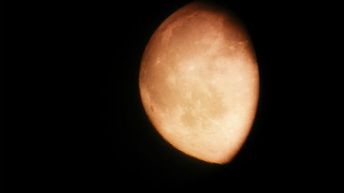 Close-up of moon over black background