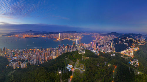 High angle view of illuminated buildings in city against sky