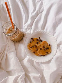 High angle view of breakfast on bed