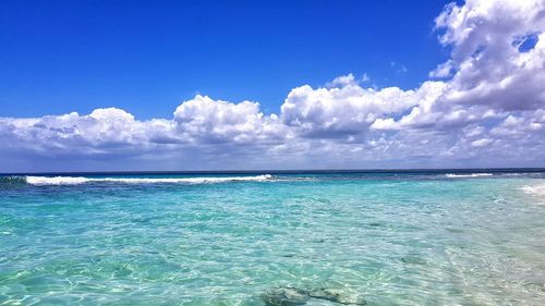 Scenic view of sea against blue sky