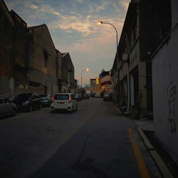 View of city street at sunset