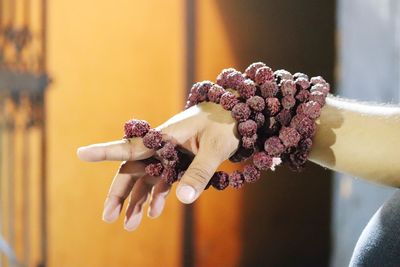 Close-up of hand holding flower