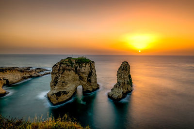 Scenic view of sea against sky during sunset