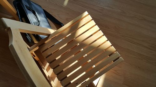 High angle view of table and chairs on hardwood floor