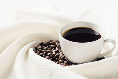 Close-up of coffee cup on table