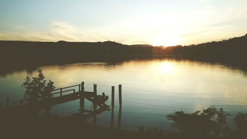 Scenic view of river at sunset