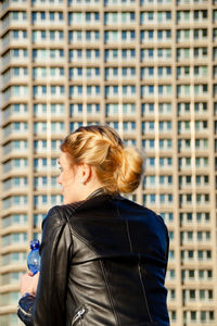 Woman in front of office building