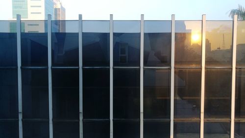 Reflection of sky on building