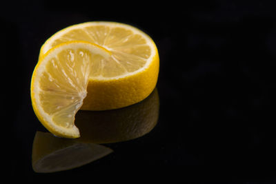 Close-up of lemon slice over black background