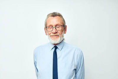 Senior man against white background