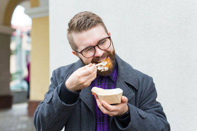 Portrait of man eating food