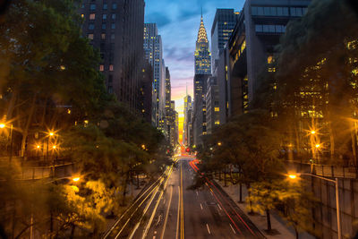 Light trails on road in city at night