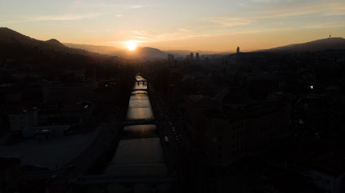 High angle view of town against sky during sunset