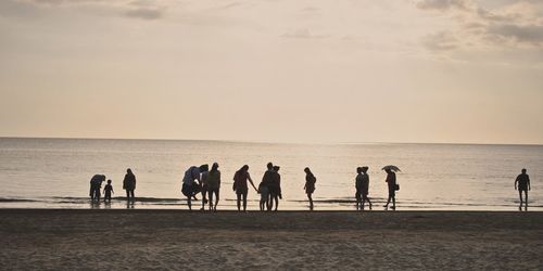 Silhouette of people on beach