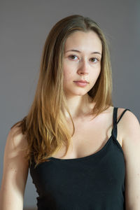 Portrait of a beautiful young woman over white background