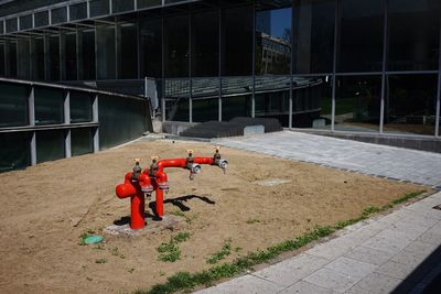 High angle view of fire hydrant on land against building