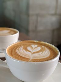 Close-up of cappuccino on table