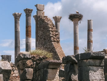 Low angle view of old ruins against sky