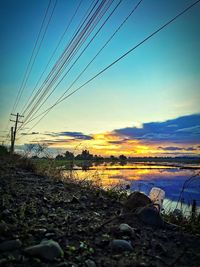 Scenic view of land against sky during sunset