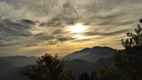 Silhouette landscape against sunset