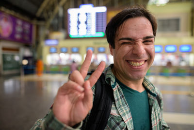 Portrait of smiling man standing outdoors