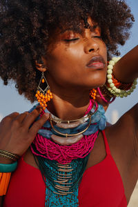 Portrait of a young black woman wearing colorful jewelry