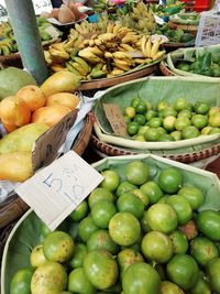 Green fruits for sale in market