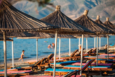 Lounge chairs and parasols on beach