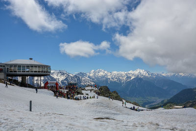 View of snowcapped mountain against cloudy sky