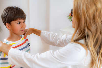 Children physical exam. checking posture and spine development