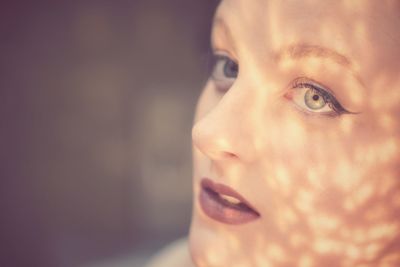 Close-up portrait of a boy looking away