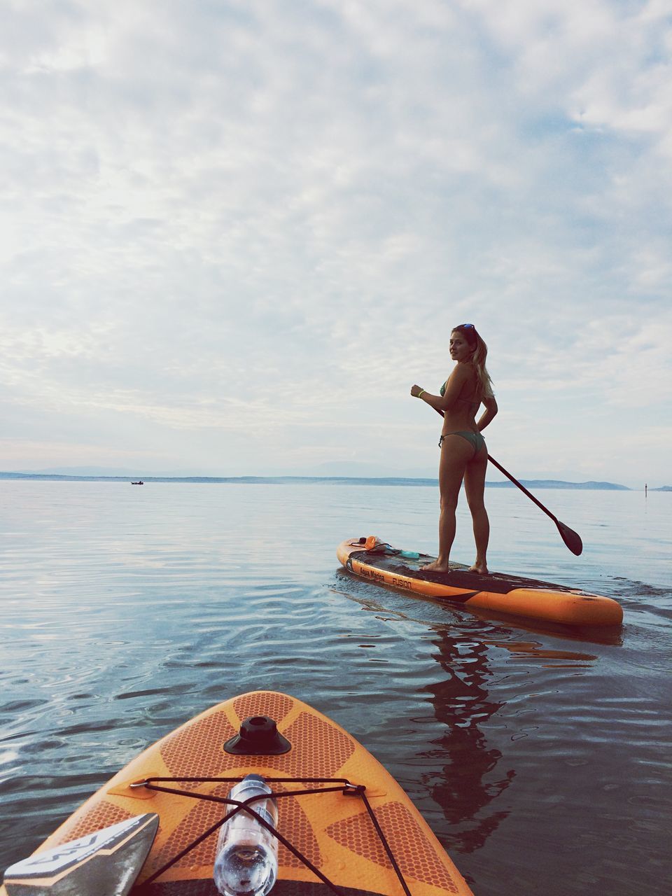 FULL LENGTH OF MAN ON BOAT AGAINST SKY