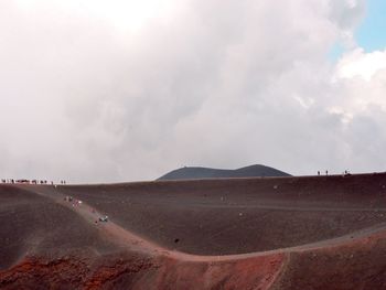 Scenic view of landscape against cloudy sky