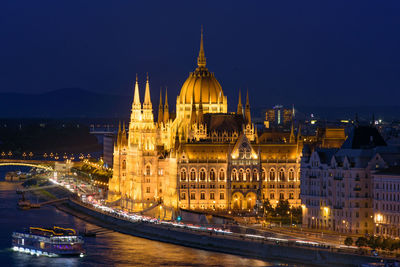 Illuminated buildings in city at night