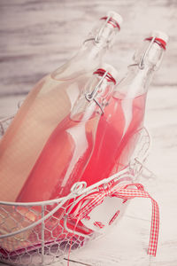 High angle view of pink bottle on table