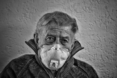 Close-up portrait of man wearing mask