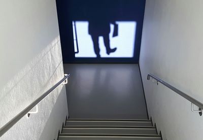High angle view of shadow in front of steps