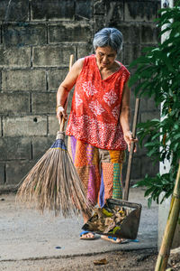 Woman working on wall