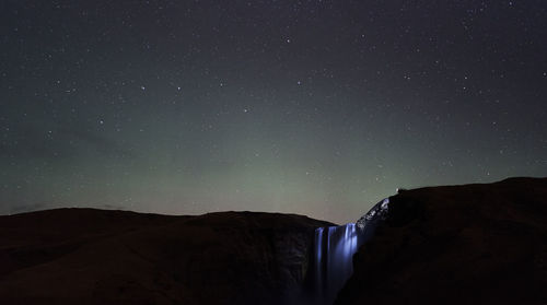 Low angle view of mountain against sky at night