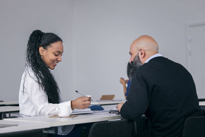 Adults working together in class