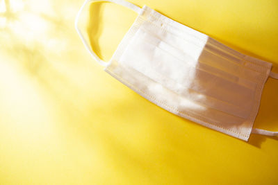 High angle view of yellow paper on table