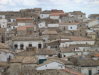 Houses in town against sky