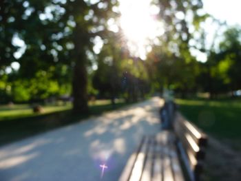 Defocused image of bench by road