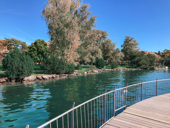 Scenic view of lake against clear blue sky